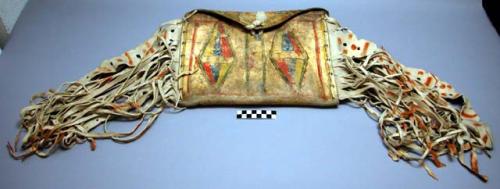 Square rawhide bag or wallet decorated with painted designs in red, yellow, blue