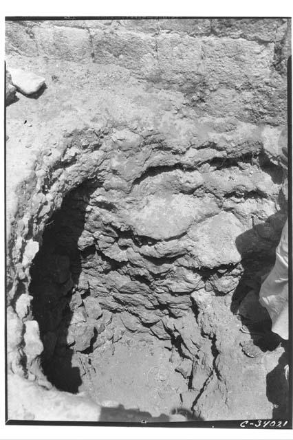 Northwest corner of Mercado Patio, a pit showing embutido laid in mortar which s