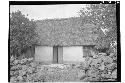 House with rubble masonry and vertical pole walls