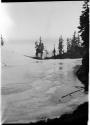 Frozen lake, with trees along shore