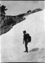 Roland B. Dixon standing on shoulder of Mount Seattle