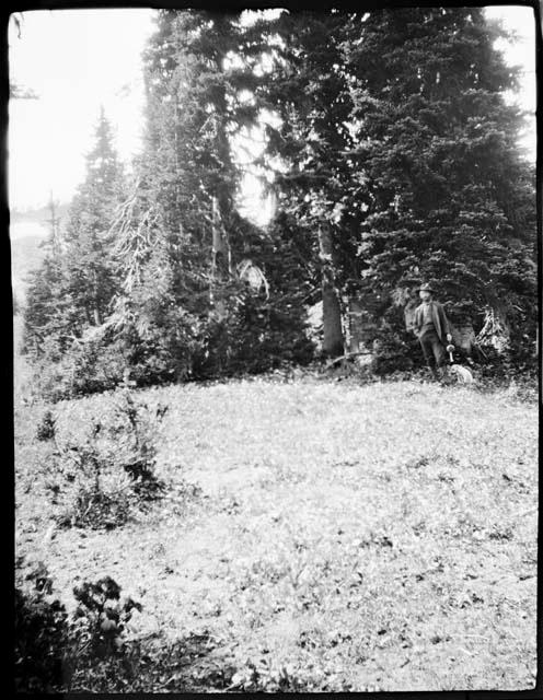 Man standing in camp at Windy Pass