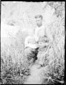 Man holding two children, near Rio Nuevo