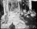 Men sitting in camp near Elwha River