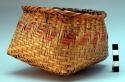 Basket woven of split cane red and yellow, square base, and round rim