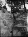 Man standing in cliff dwelling