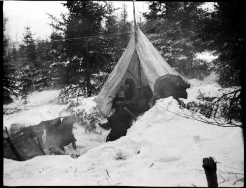 Man sitting in a tent