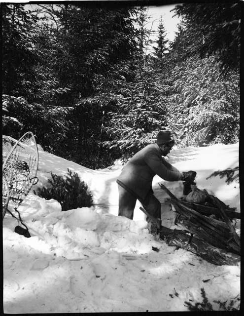 Henry Vincent Hubbard putting a pot on a fire