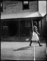 Policeman walking in front of an insurance building