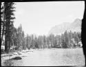 Lake and trees, with a mountain in the background