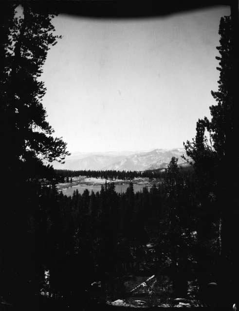 Trees and lake, with mountains in the background