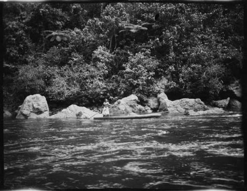 Man poling a boat along the Navua River