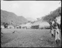 People standing, with houses in the background, in Namosi