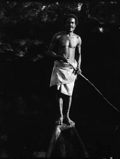 Man poling a boat on the Waidina River