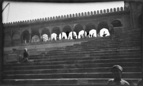 People sitting on stairs at Jama Masjid