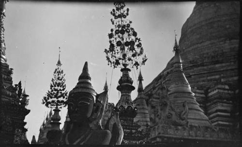 Buddha statue, with Shwedagon Pagoda in the background