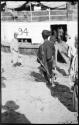 People standing next to an Irrawaddy Flotilla Company boat