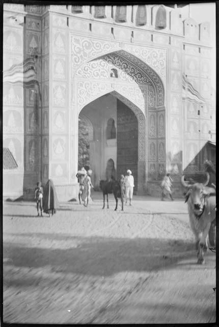 People standing in the gateway of the city wall