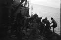 People working on the deck of a ship