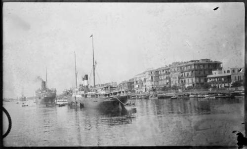 Ships, with buildings in the background