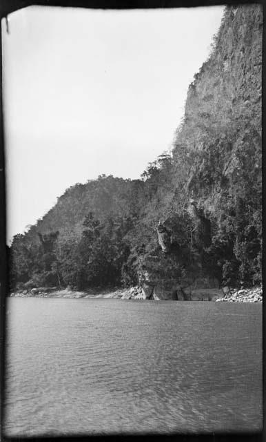 Rocks and hills along the shore of a river or lake