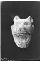 Dog's (?) head from small ball court E of Warriors. Str. 2D9