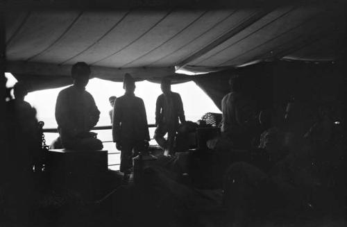 People standing on the deck of a boat