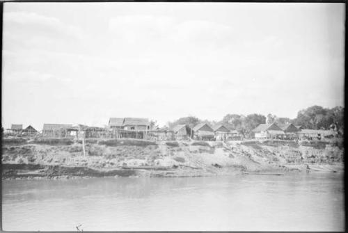 Buildings on stilts along shore