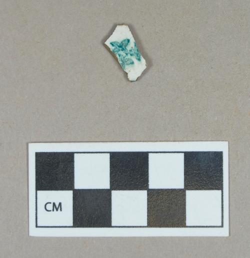 Ceramic, teal transfer printed whiteware rim sherd