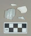 Glass, milk-glass curved body fragments