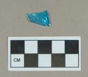 Glass, blue curved body fragment, molded