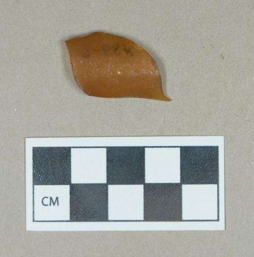 Glass, amber curved body fragment