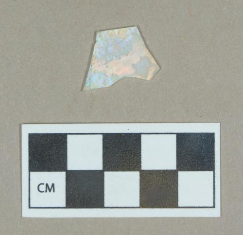 Glass, colorless opaque flat body fragment