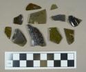 Glass, olive green curved body fragments