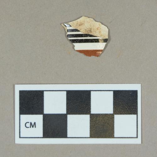 Ceramic, factory slip decorated creamware body sherd