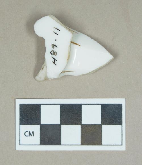 Ceramic, gilded porcelain spout?/body sherd