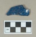 Glass, blue curved body fragment