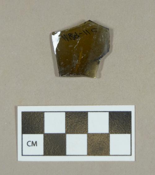 Glass, olive green curved body fragment