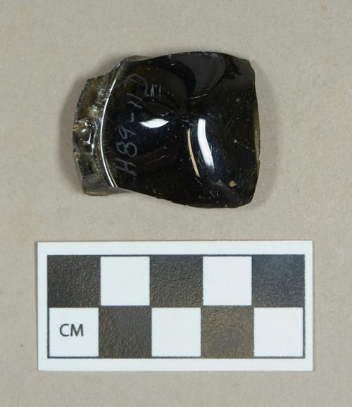 Glass, olive green bottle base fragment