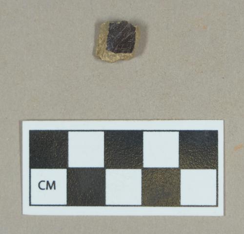 Ceramic, brown lead glazed buff bodied stoneware body sherd