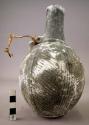 Ceramic jar, black ware, 1 hande, round body, incised design, mineral incrusted