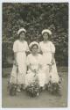 Postcard, image of three female nurses, two standing one sitting. William Cameron Forbes photograph albums of the Phillipines > Album 3