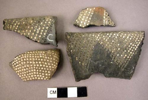 9 potsherds - black with white incisions