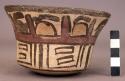 Bowl painted in polychrome with geometric motifs and stylized trophy heads?