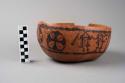 Gourd bowl , incised with burnt designs, 9" diameter