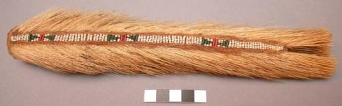 Cheyenne hair brush. Split porcupine tail wrapped, stitched w/ beaded sinew