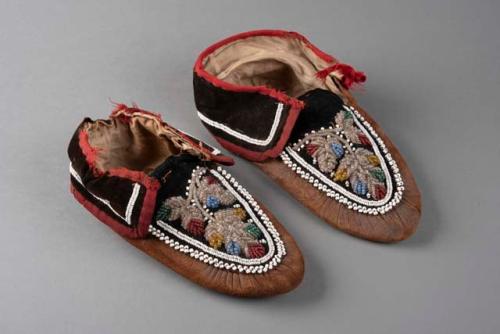 Pair of Passamaquoddy moccasins. Cloth & velvet cuffs; beaded.