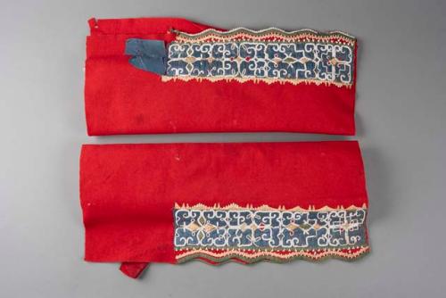 Pair of Passamaquoddy leggings. Old red trade flannel, with beads & ribbon.