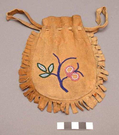 Skin pouch with bead decoration, about 7" long