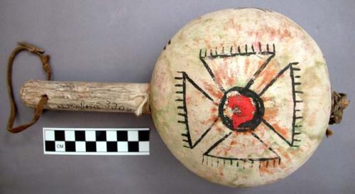 Rattle made of gourd painted in bright colors